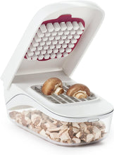 Load image into Gallery viewer, OXO Good Grips Vegetable Chopper with Easy Pour Feature - White, in use with mushrooms.