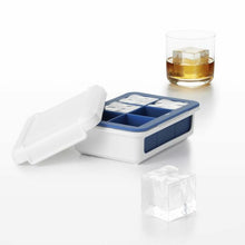 Load image into Gallery viewer, Lifestyle image of OXO Good Grips Covered Silicone Ice Cube Tray - Large Cube, with ice cube in glass.