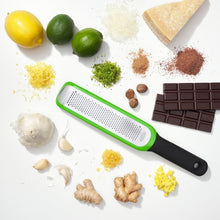 Load image into Gallery viewer, OXO Good Grips Etched Zester - Green, lifestyle image.