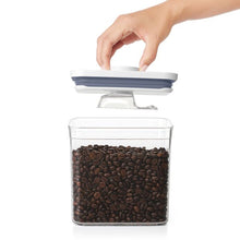 Load image into Gallery viewer, OXO Good Grips Pop Container Coffee Scoop - 30ml, on pop up container lid.