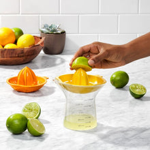 Load image into Gallery viewer, Life image showing product in use, OXO Good Grips 2-in-1 Citrus Juicer - 350ml.