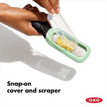Load image into Gallery viewer, OXO Good Grips Etched Ginger & Garlic Grater - Mint Green, snap-on cover and scraper.