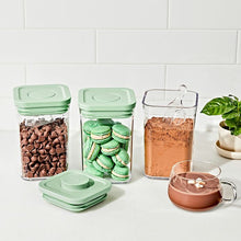 Load image into Gallery viewer, Lifestyle image of OXO Good Grips Pop Container Set with Mini Scoops - Limited Edition Pistachio, Set of 3.