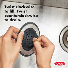 Load image into Gallery viewer, OXO Good Grips 2-in-1 Silicone Sink Strainer with Stopper, in use.