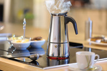 Load image into Gallery viewer, Lifestyle image of Gefu Emilio Espresso Maker - 6 cups, Stainless Steel.