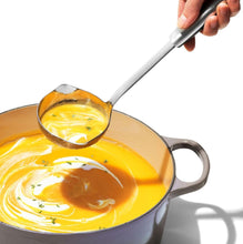 Load image into Gallery viewer, OXO Good Grips Ladle with Spouts - Stainless Steel, in use.
