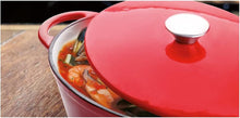 Load image into Gallery viewer, Lifestyle image of Ibili Enamelled Cast Iron Pot - Oval, Red.