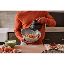 Load image into Gallery viewer, Lifestyle image of KitchenAid Go Cordless Hand Mixer with Battery - Matt Black.