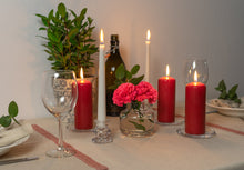 Load image into Gallery viewer, Lifestyle image of bolsius pillar candles in red.