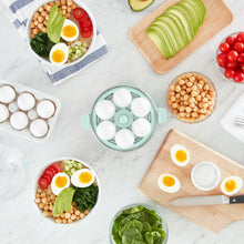 Load image into Gallery viewer, Lifestyle image of Dash Rapid Egg Cooker: 6 Egg Capacity Electric Egg Cooker, Blue.