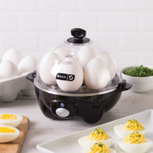 Load image into Gallery viewer, Lifestyle image of Dash Rapid Egg Cooker: 6 Egg Capacity Electric Egg Cooker.