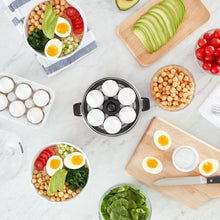 Load image into Gallery viewer, Lifestyle image of Dash Rapid Egg Cooker: 6 Egg Capacity Electric Egg Cooker.