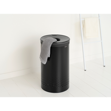 Load image into Gallery viewer, Brabantia Laundry Bin with Inner Removable Bag - 60 Liters, Matt Black, lifestyle image.
