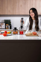 Load image into Gallery viewer, Nutricook Handi Immersion Blender, 500ML + 700ML, Black/Stainless Steel. - 1200W, in use.