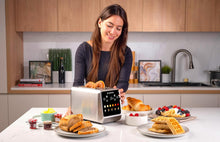 Load image into Gallery viewer, Nutricook 2-Slice Smart Toaster With Touch Screen, Stainless Steel - 850W, in use.