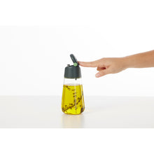 Load image into Gallery viewer, Lekue Oil and Vinegar Glass Dispenser - 1 piece, show casing lid mechanics.