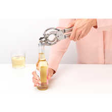 Load image into Gallery viewer, Brabantia Profile Universal Opener - Matt Steel, in use, opening bottle.