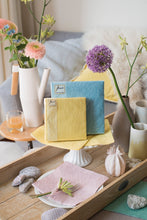 Load image into Gallery viewer, Lifestyle image of Ambiente Embossed Napkins Elegance Vanilla - Available in 2 sizes.