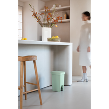 Load image into Gallery viewer, Lifestyle image of Brabantia StepUp Pedal Bin from Recycled Plastic - 10 Liters, Jade Green.