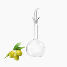 Load image into Gallery viewer, Lifestyle image of Ibili Conical Glass Anti-Drip Oil Dispenser with Round Base.