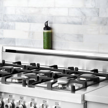 Load image into Gallery viewer, Lifestyle image of OXO Good Grips Chef's Squeeze Bottle - Available in 2 Sizes.