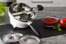 Load image into Gallery viewer, Lifestyle image of OXO Good Grips Food Mill - Stainless Steel, 2 Liters.
