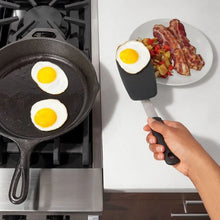 Load image into Gallery viewer, Lifestyle image of OXO Good Grips Small Silicone Flexible Turner - Black.
