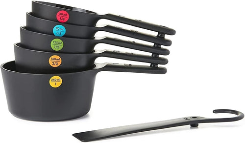 OXO Good Grips Set of 5 Measuring Cups + Scraper - Black, side view.