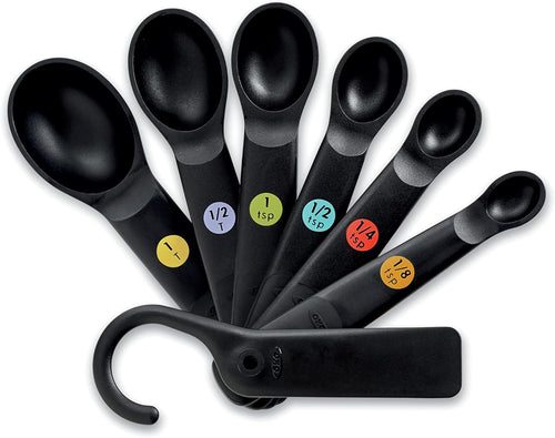 OXO Good Grips Set of 6 Measuring Spoons + Scraper - Black, top view.