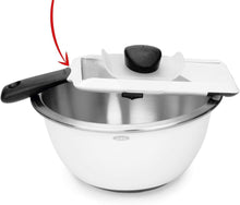 Load image into Gallery viewer, OXO Good Grips Adjustable Handheld Mandoline Slicer - White, in use on bowl.
