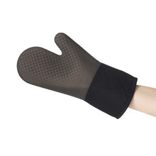 Load image into Gallery viewer, OXO Good Grips Silicone Oven Mitt - Black/ Dark Grey, in use.
