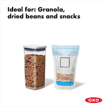Load image into Gallery viewer, OXO Good Grips Pop Container - Small Square Medium, 1600ml, filled with granola next to granola bag.

