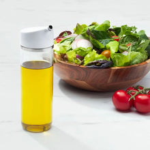 Load image into Gallery viewer, Lifestyle image of OXO Good Grips Precision Pour Glass Dispenser 355ml.
