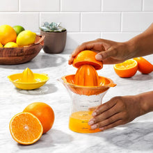 Load image into Gallery viewer, OXO Good Grips 2-in-1 Citrus Juicer - 350ml, image of product in use.
