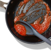 Load image into Gallery viewer, OXO Good Grips Silicone Spoon - Peppercorn, in use.
