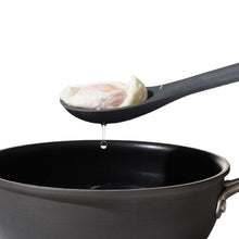 Load image into Gallery viewer, Lifestyle image of OXO Good Grips Silicone Slotted Spoon - Peppercorn.
