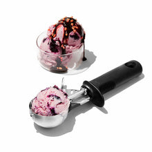 Load image into Gallery viewer, OXO Good Grips Trigger Ice Cream Scoops - Black, in use.
