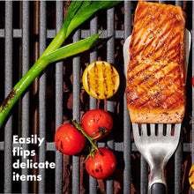 Load image into Gallery viewer, OXO Good Grips Grilling Precision Turner - Stainless Steel, in use.
