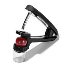 Load image into Gallery viewer, OXO Good Grips Olive &amp; Cherry Pitter - Black, angled vie, with cherry.
