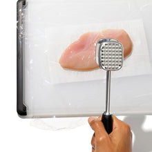 Load image into Gallery viewer, OXO Good Grips Meat Tenderizer - Die-Cast, in use on chicken breast.
