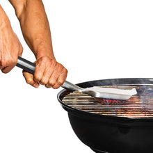 Load image into Gallery viewer, OXO Good Grips Coiled Grill Brush with Replaceable Head - Stainless Steel, in use.
