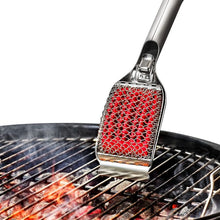 Load image into Gallery viewer, Lifestyle image of OXO Good Grips Coiled Grill Brush with Replaceable Head - Stainless Steel.
