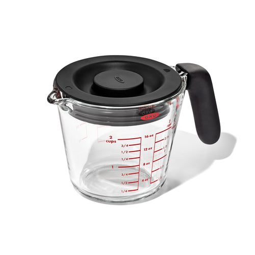 OXO Good Grips Glass Measuring Cup with Lid - 500ml, angled view.