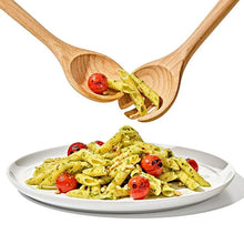Load image into Gallery viewer, Lifestyle image of OXO Good Grips Beechwood Salad Servers, 2-Piece Set, in use.
