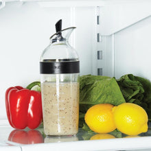Load image into Gallery viewer, Lifestyle image of OXO Good Grips Salad Dressing Shaker - Available in 2 Sizes, Black.
