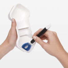 Load image into Gallery viewer, OXO Good Grips Kitchen Detail Cleaning Brush Set - White/Blue, in use.
