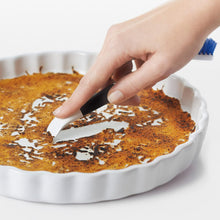 Load image into Gallery viewer, OXO Good Grips Kitchen Detail Cleaning Brush Set - White/Blue, in use on baking pan.
