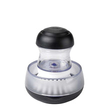 Load image into Gallery viewer, OXO Good Grips Soap Dispensing Palm Brush - Black/White.
