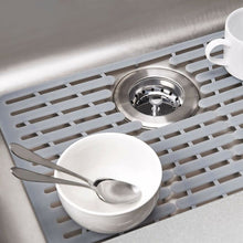 Load image into Gallery viewer, Lifestyle image of OXO Good Grips Silicone Sink Mat - Small. 

