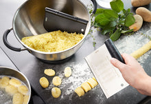 Load image into Gallery viewer, Lifestyle image of Gefu Duto Dough Scraper &amp; Cutter - Set of 2.
